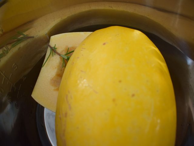 image of squash and rosemary arranged inside pressure cooker