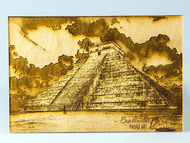 photo of Mayan pyramid with a tiny person standing in front