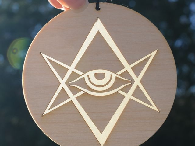 wood disk with symbol glowing though