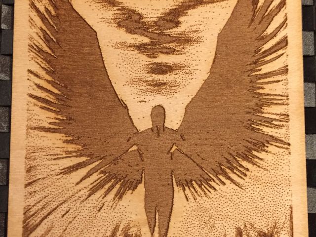 engraved angel lit from the front
