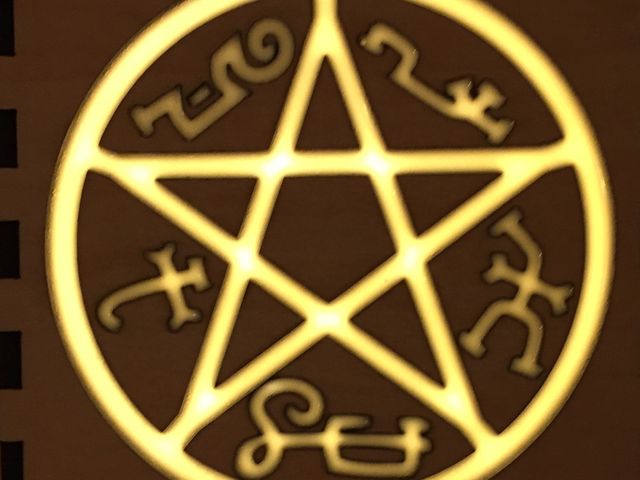 maple wood panel with glowing resin filled symbol