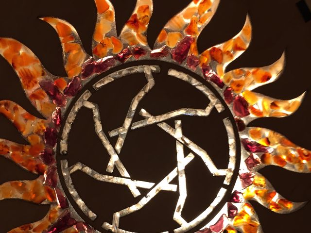 maple wood panel with glowing resin and gem filled symbol