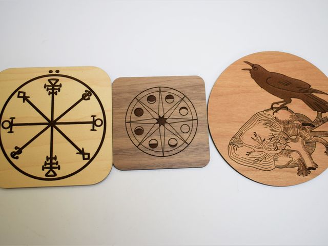 image of three laser cut coasters in different wood types