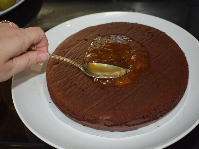 image of spreading jam on cake